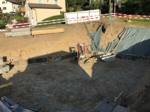 Hochbau-Neubau-Engadinerhaus-erdgeschoss-aushubarbeiten-sickerleitungen-kanalisation